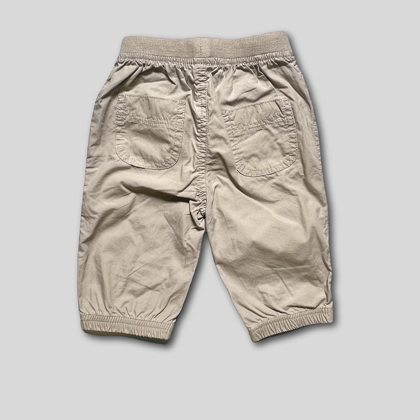 Pantalon crem cu dinozaur